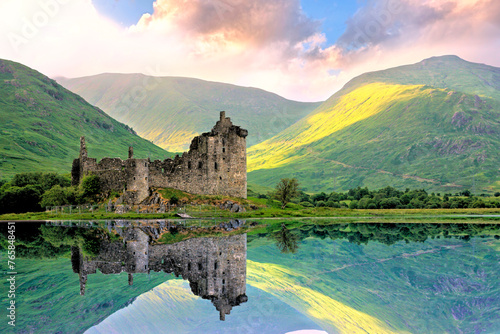 Beautiful Kilchurn Castle on Lock Awe in the highlands of Scotland at sunset with reflections