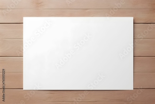 white sheet of paper on a wooden background. copy space
