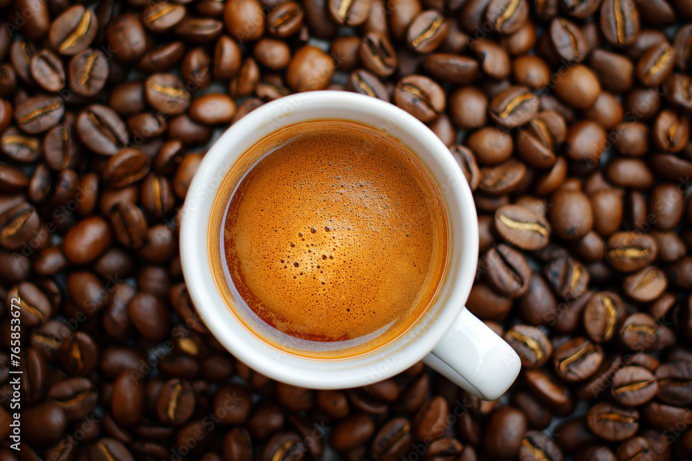 Coffee cup with coffee beans top view. Cup of freshly brewed espresso closeup on roasted coffee beans background. Coffee cup with coffee beans top view. Cup of freshly brewed espresso closeup on roasted coffee beans background.