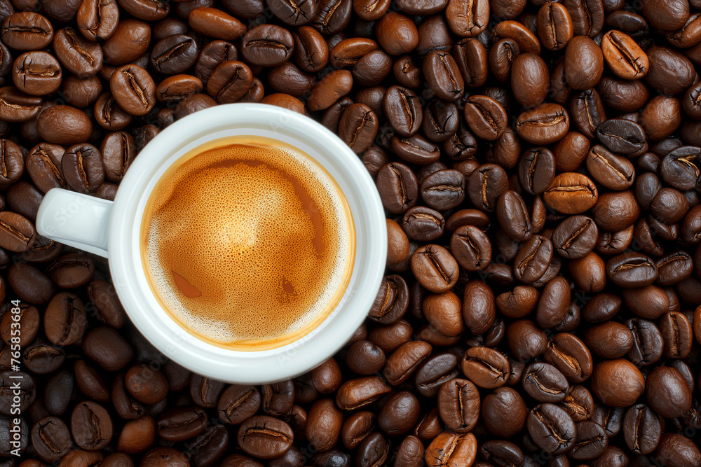Coffee cup with coffee beans top view. Cup of freshly brewed espresso closeup on roasted coffee beans background. Coffee cup with coffee beans top view. Cup of freshly brewed espresso closeup on roasted coffee beans background.