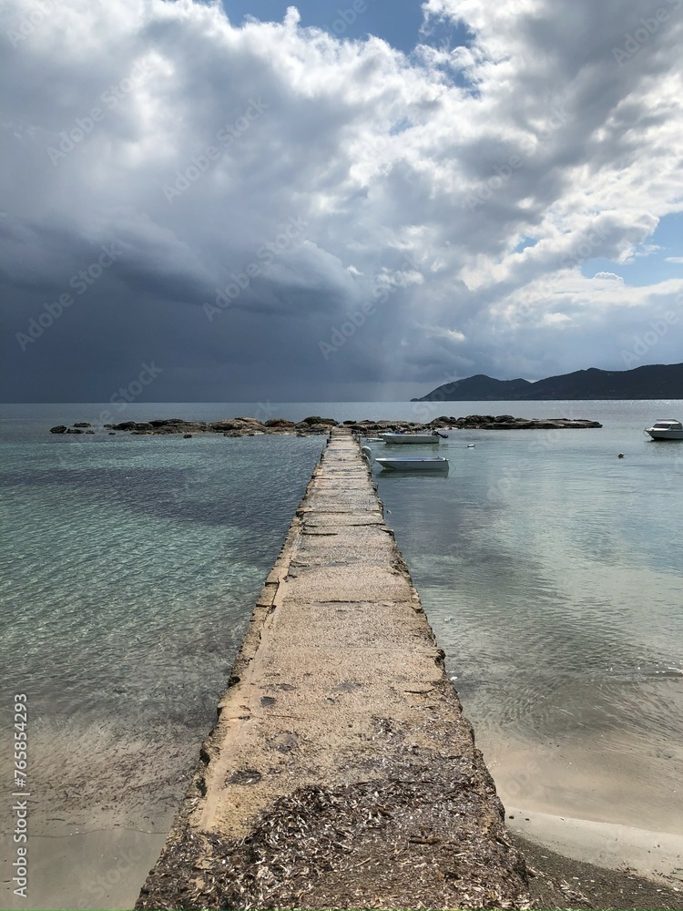 Old Ibiza pier on stormy day