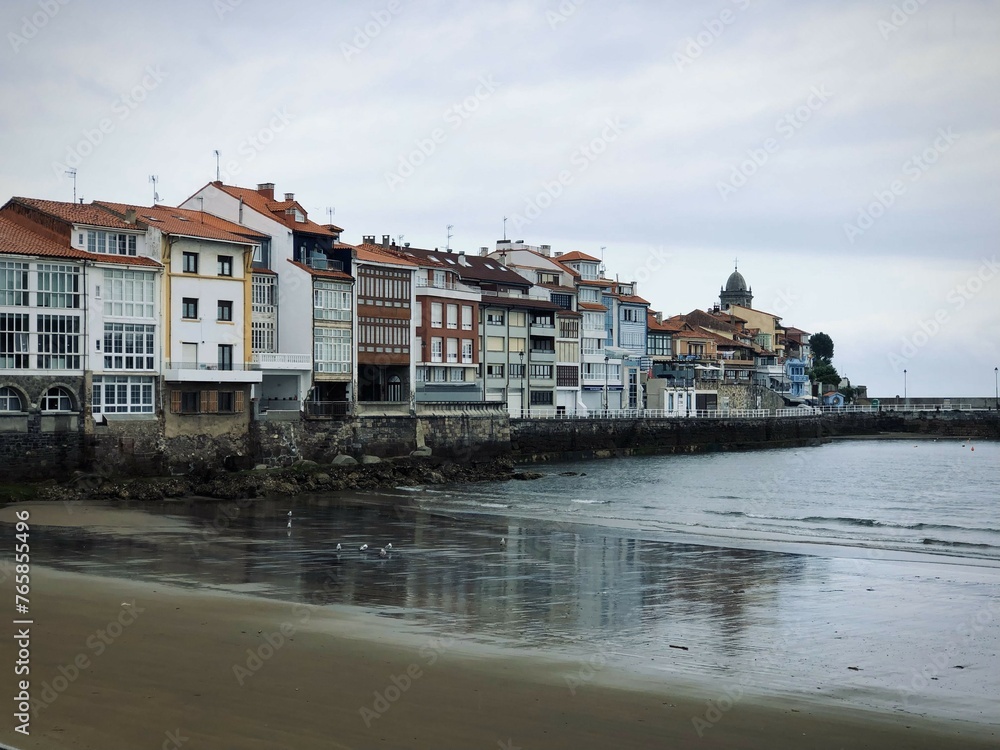 Traditional houses on the ocean shore with low tide