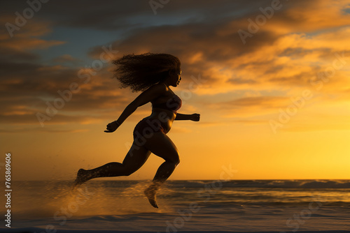 Woman running on the beach in bikini
