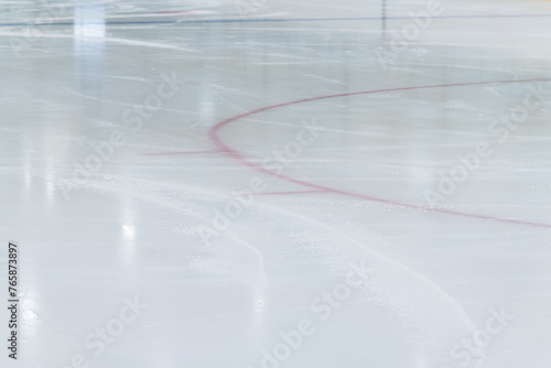 Indoor year-round ice rink. People skate on a skating rink on artificial ice. Skates ride on artificial ice