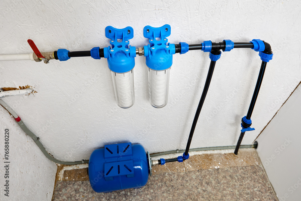 Utility room which water bladder tank and purification filters for cold drinking water of domestic water supply system. - obrazy, fototapety, plakaty 
