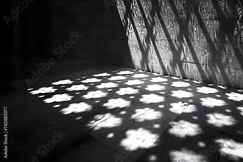 Light streaming through a window on a stair, grayscale image of a bridge with rails


