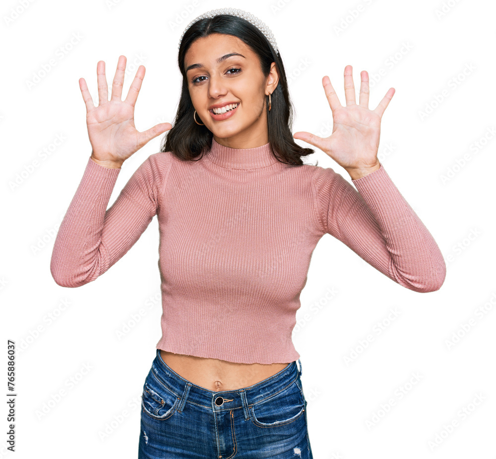 Young hispanic girl wearing casual clothes showing and pointing up with fingers number ten while smiling confident and happy. Young hispanic girl wearing casual clothes showing and pointing up with fingers number ten while smiling confident and happy.