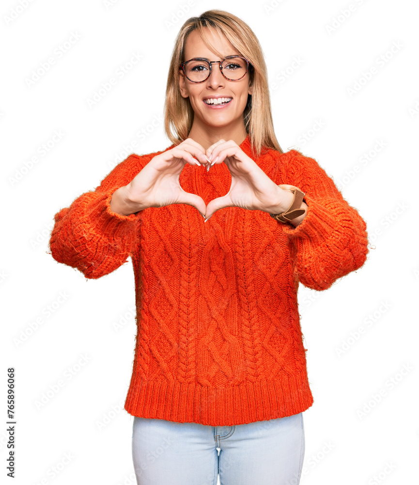 Fototapeta premium Beautiful blonde woman wearing casual clothes and glasses smiling in love doing heart symbol shape with hands. romantic concept.