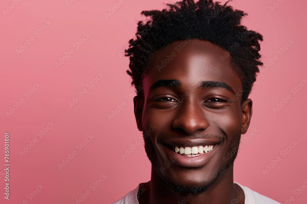Infectious Smile of a Young Black Man, Contemporary Style Against a Pink Background Infectious Smile of a Young Black Man, Contemporary Style Against a Pink Background