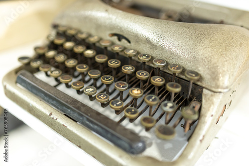 Old typewriter, close-up, shallow depth of field.