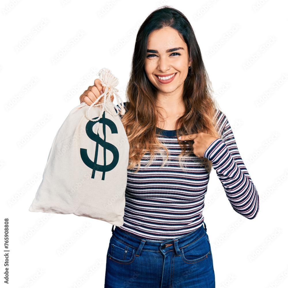 Beautiful hispanic woman holding dollars bag pointing finger to one self smiling happy and proud Beautiful hispanic woman holding dollars bag pointing finger to one self smiling happy and proud