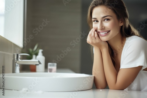 Woman Sitting in Front of Bathroom Sink