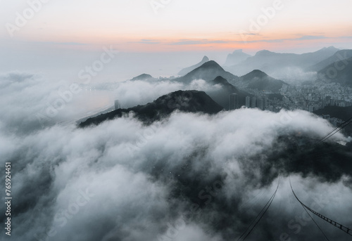 rio de janeiro fog in the mountains over the city at sunset