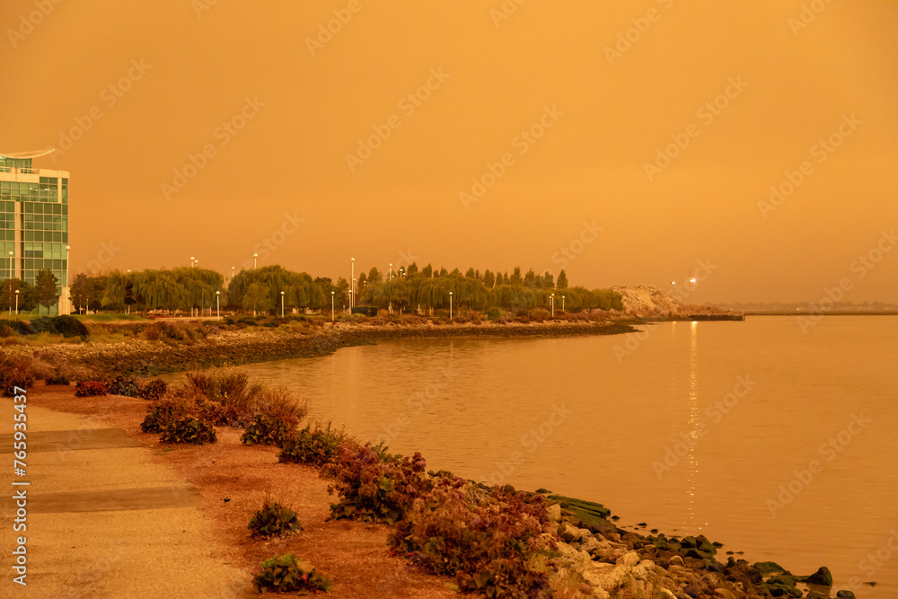 Dark Orange Smoky Skies at the Redwood City California Westpoint Slough from Nearby Out of Control Wildfires Caused by Drought and Climate Change
