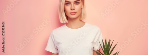 Cute young woman blonde hair with bob haircut isolated on flat pink background with copy space. Cute girl in white simple t-shirt.  photo