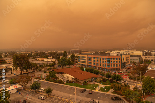 Thick Haze of Orange Smoke Laden Skies Over Redwood City California as a Result of Nearby Wildfires Forest Fires Caused by Climate Change Global Warming and Drought photo