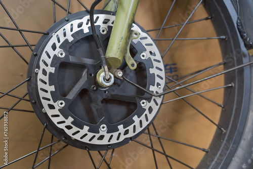 Electric bike front hydraulic disc brake rotor close up