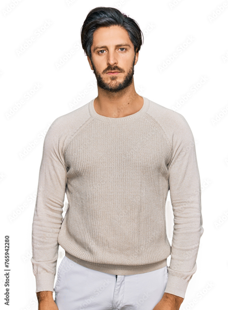 Young hispanic man wearing casual clothes with serious expression on face. simple and natural looking at the camera. Young hispanic man wearing casual clothes with serious expression on face. simple and natural looking at the camera.