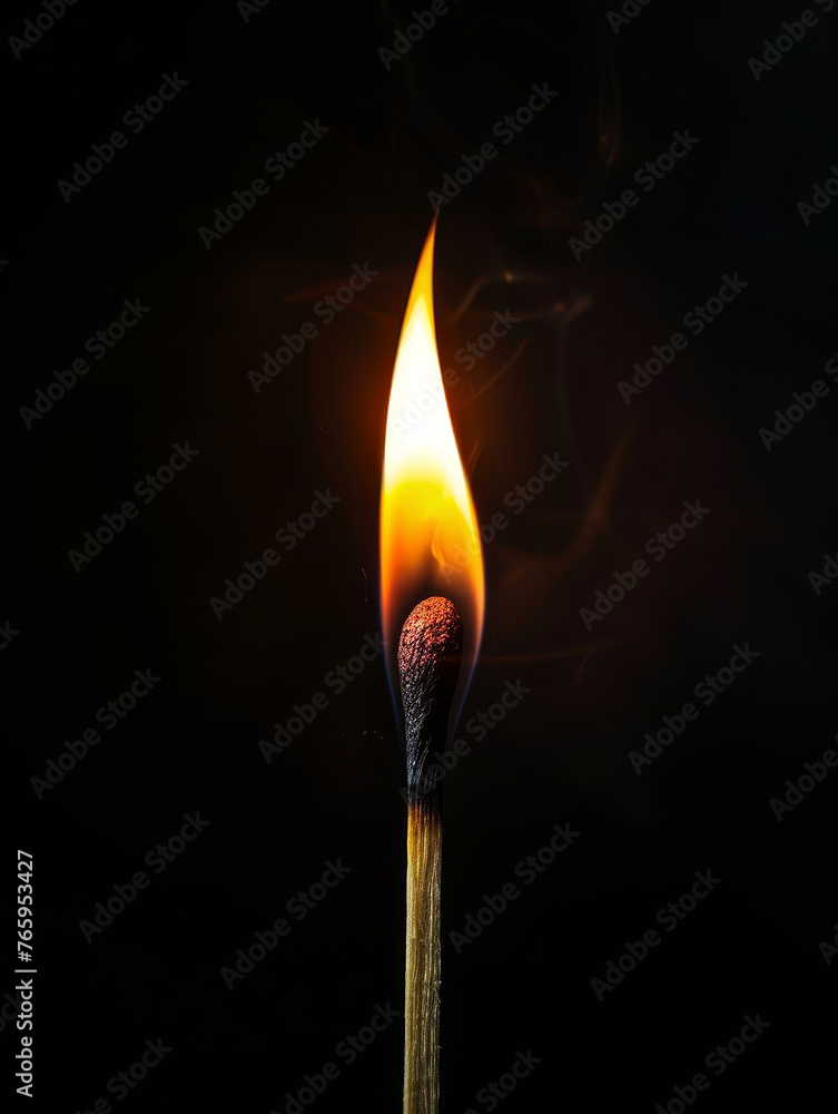 A burning match with a bright flame on a black background . A burning match with a bright flame on a black background .
