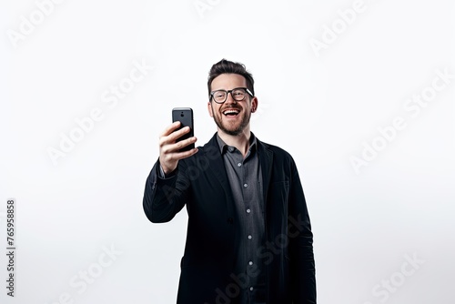 Man laughing and taking a selfie with his smartphone