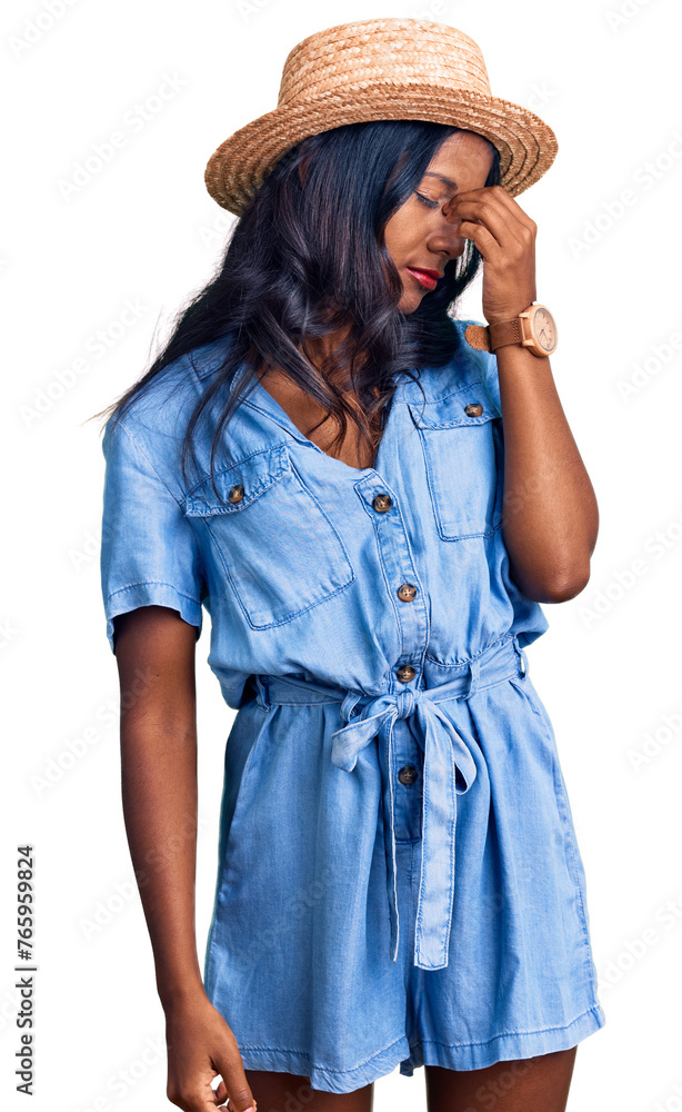 Young indian girl wearing summer hat tired rubbing nose and eyes feeling fatigue and headache. stress and frustration concept. Young indian girl wearing summer hat tired rubbing nose and eyes feeling fatigue and headache. stress and frustration concept.