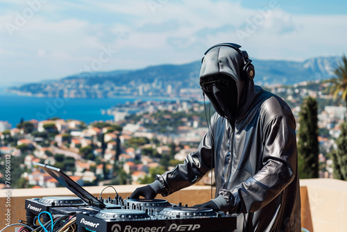 Photo of a hacker wearing a balaclava and headphones, with their face covered, playing on DJ turntables in the style of a villa at the French Riviera against the backdrop of a villa at the French Rivi photo