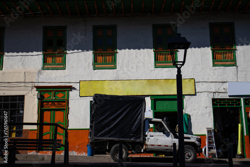 View of the houses around the central square of the beautiful small town of Pacora in Colombia photo