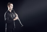 Clarinet player classical musician portrait. Clarinetist playing woodwind instrument