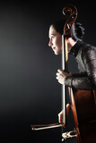 Cello player cellist playing violoncello in profile