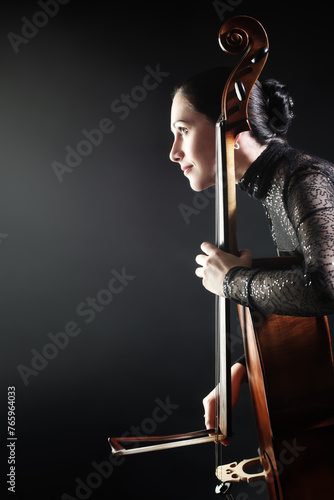 Cello player cellist playing violoncello in profile