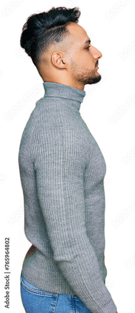 Young arab man wearing casual clothes looking to side, relax profile pose with natural face with confident smile. Young arab man wearing casual clothes looking to side, relax profile pose with natural face with confident smile.