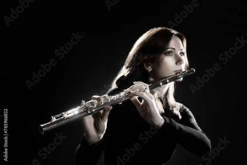 Flute player. Flutist playing flute music instrument