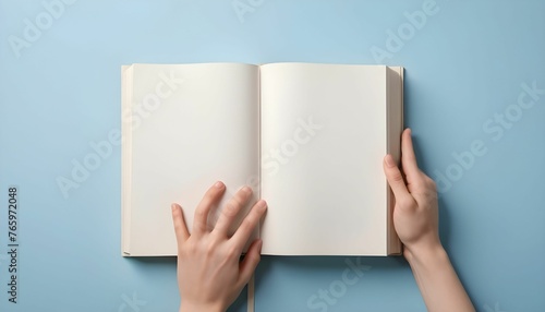 hand open the blank book on pastel blue background on world book day, with copy space , back to school created with generative ai photo
