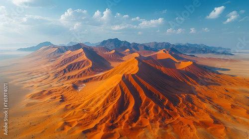 Aerial shot of giant sand dunes in the desert. 