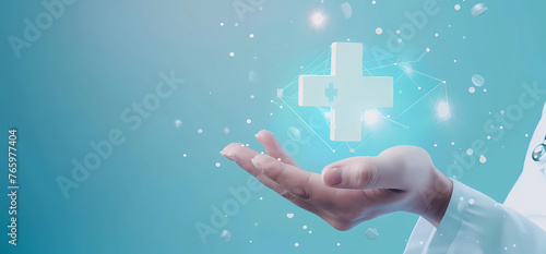 Hand holding medical cross symbol glowing on blue background © Food gallery