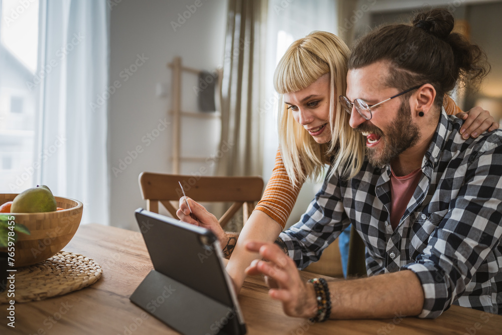adult happy couple man and woman shopping online hold credit card adult happy couple man and woman shopping online hold credit card