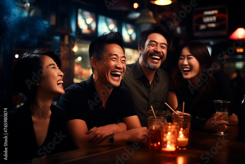 Young men of Asian appearance, partying and drinking at a bar, merrily discussing an interesting topic