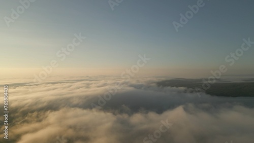 Aerial view of foggy mountain valley on an early Spring morning © Daniel Merlin Miller