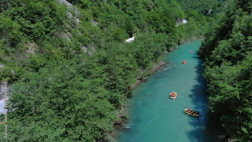 Aerial view of rafting boats on turquoise mountain river. Tara river canyon in Montenegro, 4k Aerial view of rafting boats on turquoise mountain river. Tara river canyon in Montenegro, 4k