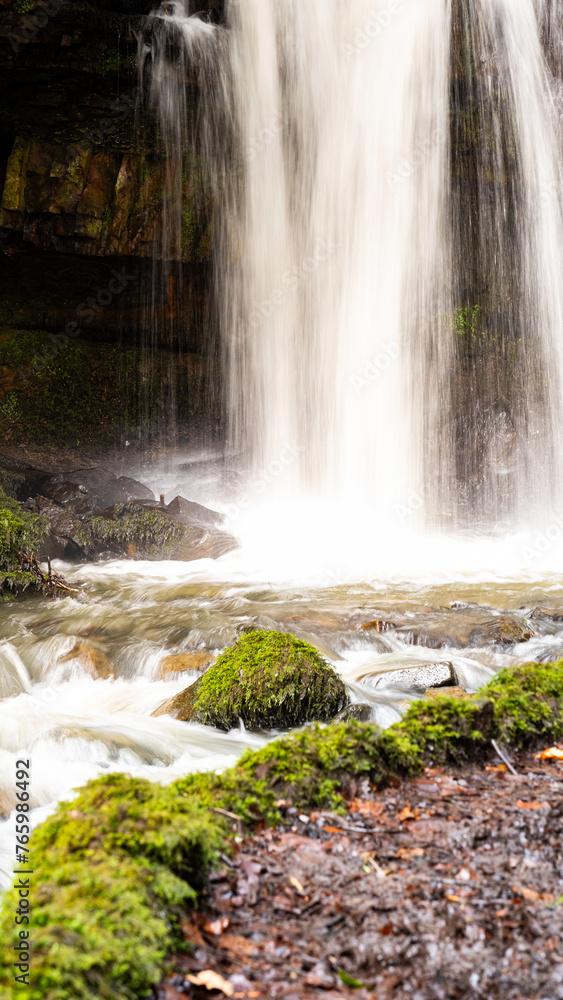 Obraz premium Close up of a waterfall in the forest