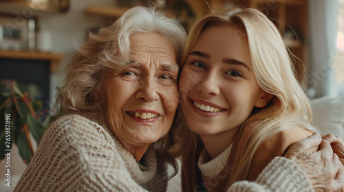 Elderly Mom and Daughter Sharing Smiles and Laughter at Home. Warm family relationship.
