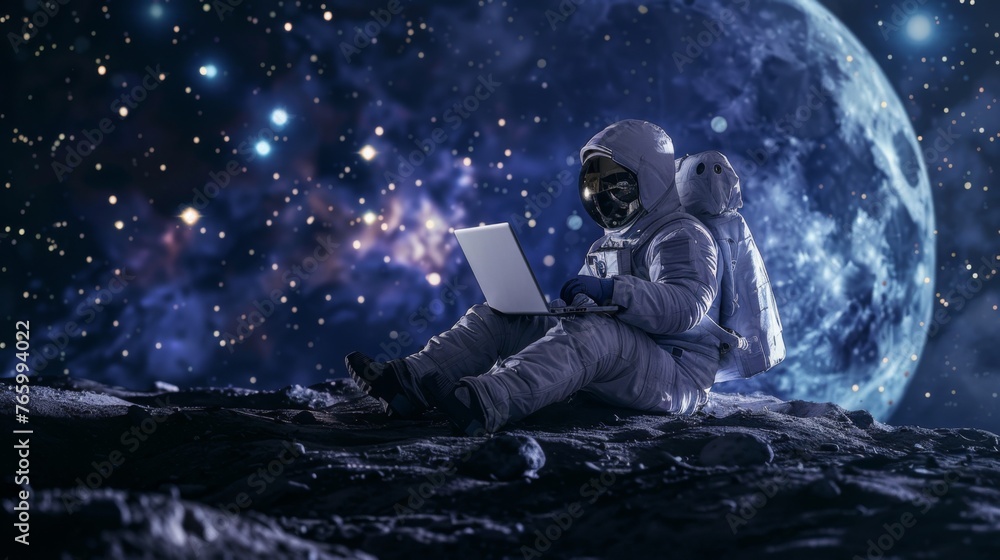 Obraz premium Astronaut on the Moon is using a laptop