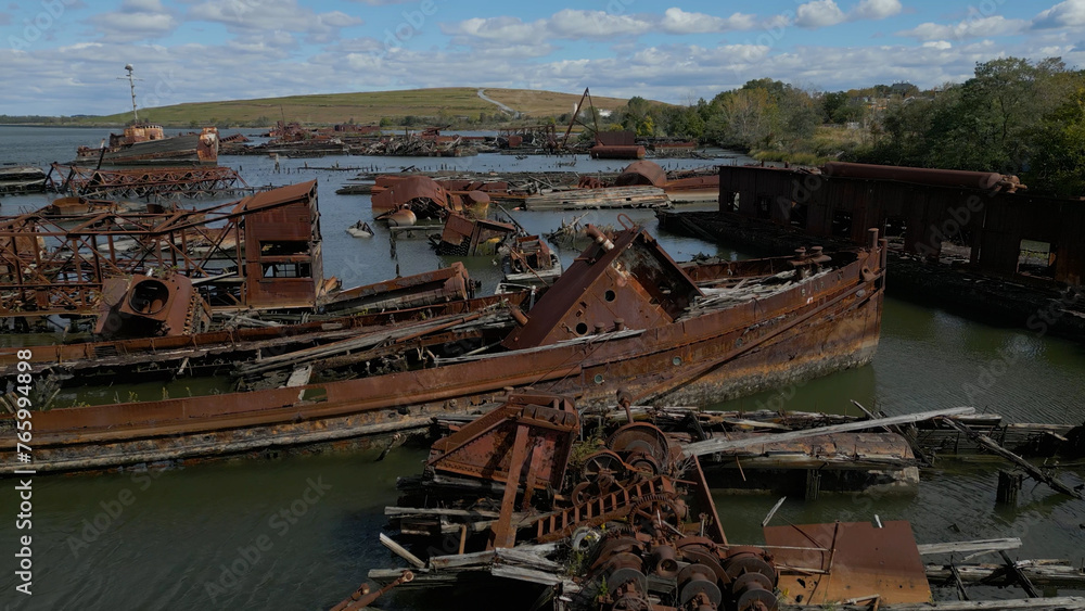 Remains of ship vessels disintegrating in harbor Remains of ship vessels disintegrating in harbor