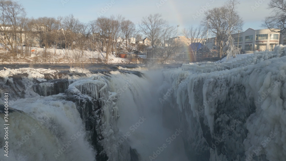 Obraz premium Cascading waterfall in New Jersey during winter | drone 4K
