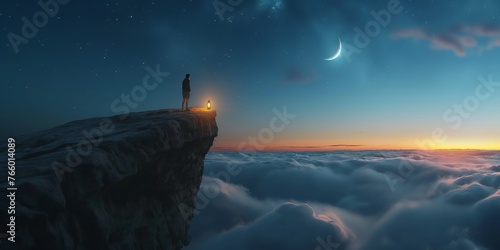 Person with lantern on the edge of rock cliff with sea of clouds and moon at sunset
