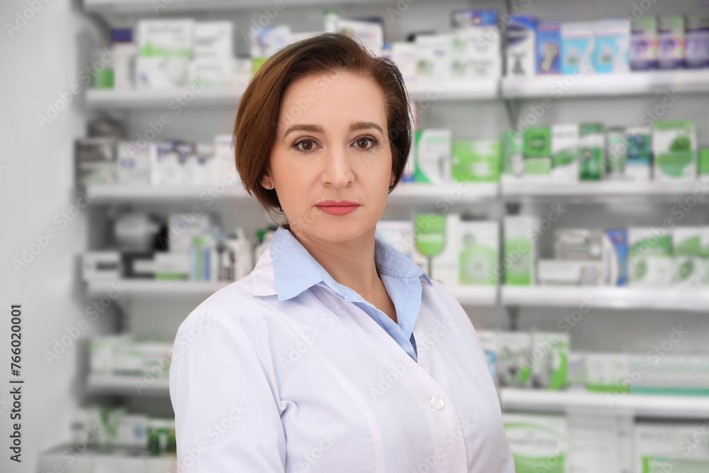 Portrait of professional pharmacist in modern drugstore