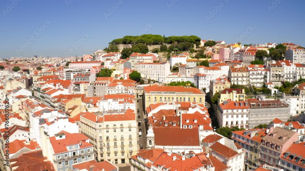 Aerial Scenic View Of Famous Historic Castle On Hill, Drone Flying Forward Over Roofed Houses In Residential City During Sunny Day - Lisbon, Portugal Aerial Scenic View Of Famous Historic Castle On Hill, Drone Flying Forward Over Roofed Houses In Residential City During Sunny Day - Lisbon, Portugal