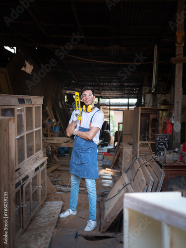 The Man working as carpenters in theirs carpentry workshop . businessman entrepreneur leading a business. Stylish Furniture Designer Working in a Studio