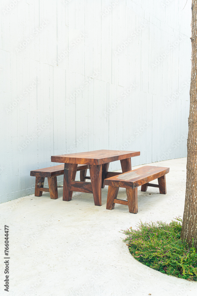 empty wood outdoor patio table and chair set