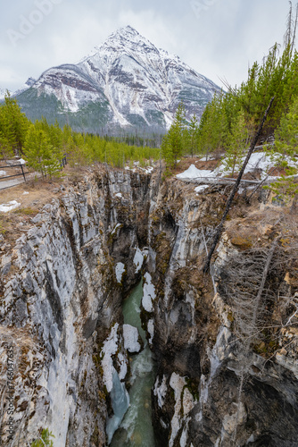 Stunning Marble Canyon in Banff National Park during the spring time with huge snow capped mountain in background. 